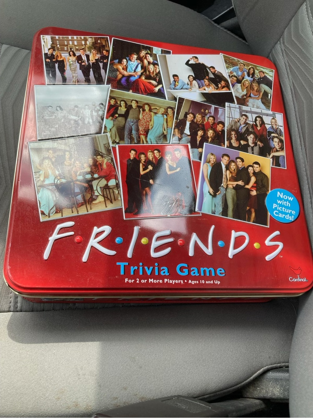 Friends Trivia Game Cardinal Industries test knowledge of the TV show red tin